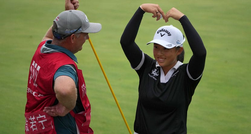 Ruoning Yin of China celebrates after winning in the final round of the LPGA Shanghai golf tournament at China's Shanghai Qizhong Garden Golf Club, Sunday, Oct. 13, 2024. (AP Photo/Achmad Ibrahim)