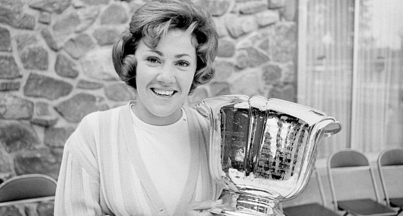 Susie Maxwell holds the silver trophy after winning the 36th annual Women's Western golf tournament, June 14, 1965, in Chicago. (AP Photo/Larry Stoddard, File)