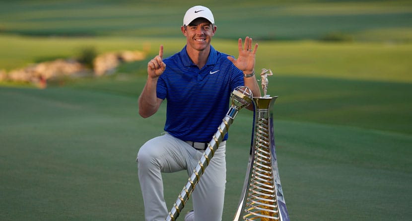 Rory McIlroy of Northern Ireland poses with the DP World Tour Championship trophy and the Race to Dubai trophy after winning the World Tour Golf Championship in Dubai, United Arab Emirates, Sunday, Nov. 17, 2024. (AP Photo/Altaf Qadri)