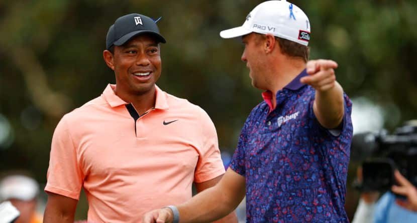 Tiger Woods, left, laughs with Justin Thomas during the first round of the PNC Championship golf tournament Saturday, Dec. 18, 2021, in Orlando, Fla. (AP Photo/Scott Audette)