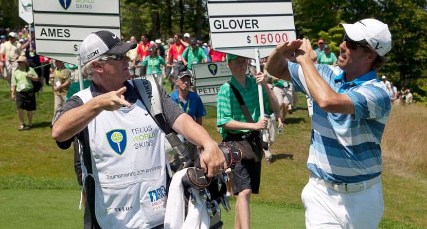 Canada's Steve Ames, right, and his caddie, Adrian Watey, chat during the Telus World Skins game at Glen Arbour golf course in Halifax, Nova Scotia, on Tuesday, July 31, 2012. (Andrew Vaughan/The Canadian Press via AP)