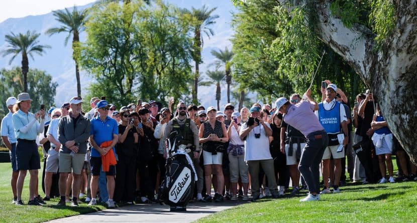 Fans watch as Justin Thomas hits to the fourth fairway at La Quinta Country Club Course during the first round of the American Express golf tournament in La Quinta, Calif., Thursday, Jan. 16, 2025. (AP Photo/William Liang)