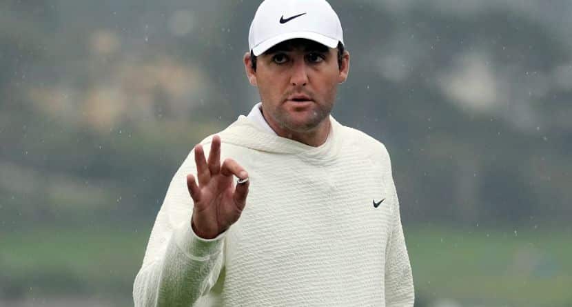 Scottie Scheffler gestures on the 18th green at Pebble Beach Golf Links during the third round of the AT&T Pebble Beach National Pro-Am golf tournament in Pebble Beach, Calif., Saturday, Feb. 3, 2024. (AP Photo/Ryan Sun)