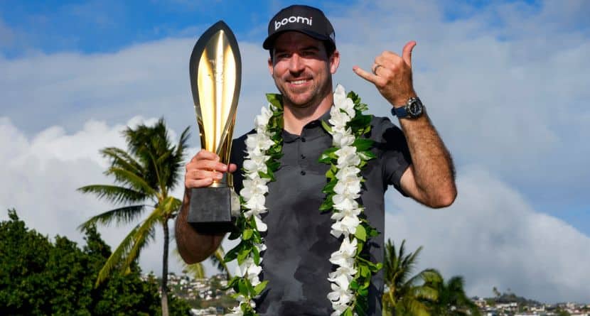 Nick Taylor, of Canada, poses with his trophy after winning the Sony Open golf event, Sunday, Jan. 12, 2025, at Waialae Country Club in Honolulu. (AP Photo/Matt York)