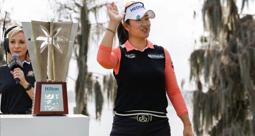 A Lim Kim, right, reacts to the crowd after being announced as the winner of the Hilton Grand Vacations Tournament of Champions LPGA golf tournament in Orlando, Fla., Sunday, Feb. 2, 2025. (AP Photo/Kevin Kolczynski)