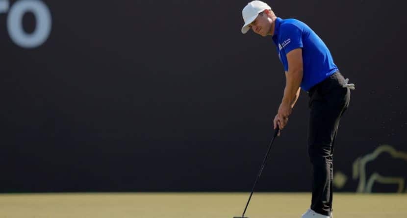 Calum Hill of Scotland plays a shot on the 18th green during the third round of the Dubai Desert Classic golf tournament, in Dubai, United Arab Emirates, Saturday, Jan. 18, 2025. (AP Photo/Altaf Qadri)