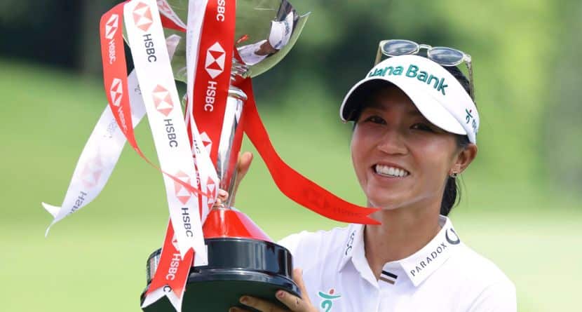 Lydia Ko of New Zealand celebrates with the trophy after winning the the HSBC Women's World Championship 2025 at Sentosa Golf Club in Singapore, Sunday, March 2, 2025. (AP Photo/Suhaimi Abdullah)