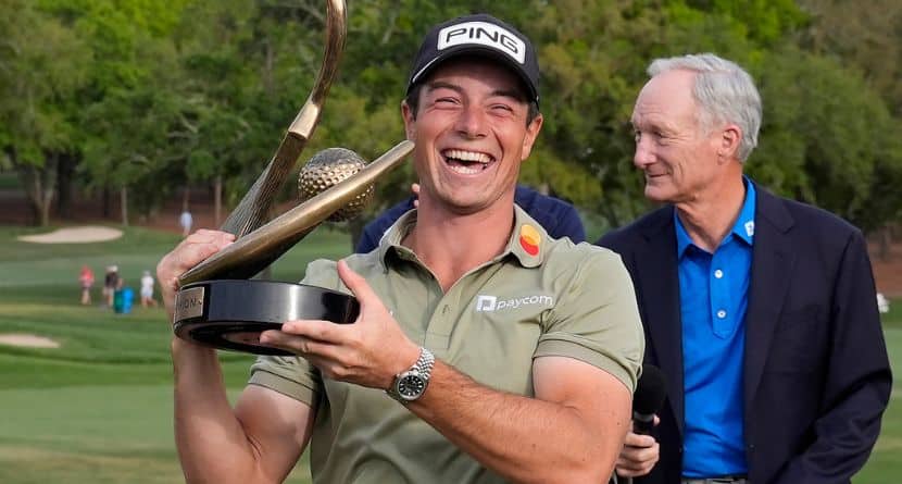 Viktor Hovland, of Norway, reacts as he hold the trophy after winning the Valspar Championship golf tournament Sunday, March 23, 2025, at Innisbrook in Palm Harbor, Fla. (AP Photo/Chris O'Meara)