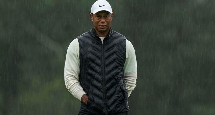 Tiger Woods walks on the 18th hole during the weather delayed second round of the Masters golf tournament at Augusta National Golf Club on April 8, 2023, in Augusta, Ga. (AP Photo/Charlie Riedel)