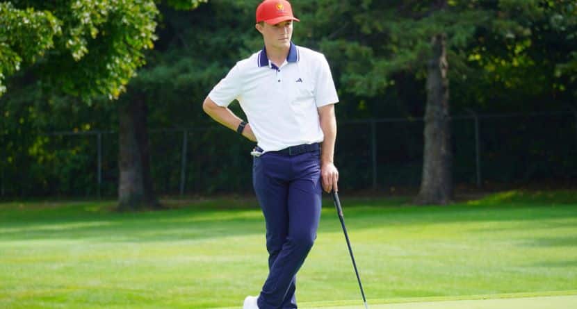 In this image provided by the American Junior Golf Association, Blades Brown leans on his putter during a practice round for the Junior Presidents Cup at Le Club Laval-sur-le-Lac in Montreal, Sept. 21, 2024. (American Junior Golf Association via AP)