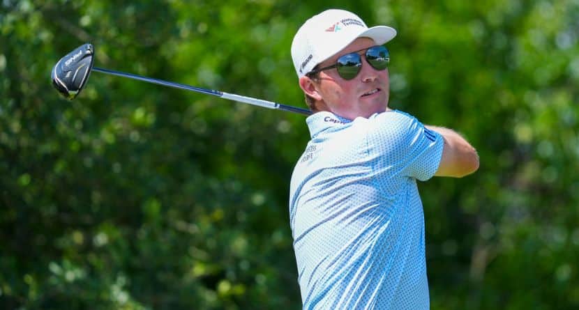 Ben Griffin hits off the ninth tee on the during the first round of the Charles Schwab Challenge golf tournament at Colonial Country Club in Fort Worth, Texas, Thursday, May 22, 2025. (AP Photo/LM Otero)