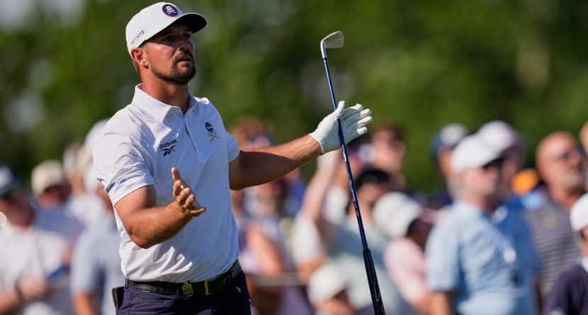 Bryson DeChambeau reacts after hitting his tee shot into the water on the 17th hole during the third round of the PGA Championship golf tournament at the Quail Hollow Club, Saturday, May 17, 2025, in Charlotte, N.C. (AP Photo/George Walker IV)