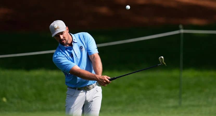 Bryson DeChambeau chips to the green on the second hole during a practice round for the PGA Championship golf tournament at the Quail Hollow Club, Tuesday, May 13, 2025, in Charlotte, N.C. (AP Photo/George Walker IV)