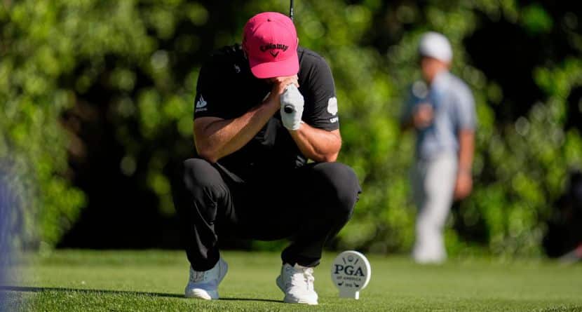 Jon Rahm, of Spain, reacts to his tee shot on the 14th hole during the final round of the PGA Championship golf tournament at the Quail Hollow Club, Sunday, May 18, 2025, in Charlotte, N.C. (AP Photo/George Walker IV)