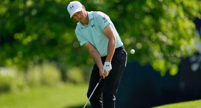 Jordan Spieth chips to the green on the 12th hole during the first round of the PGA Championship golf tournament at the Quail Hollow Club, Thursday, May 15, 2025, in Charlotte, N.C. (AP Photo/Matt York)