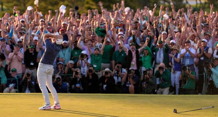The crowd cheers as Rory McIlroy, of Northern Ireland, celebrates winning the Masters golf tournament in Augusta, Georgia, April 13, 2025. (AP Photo/Ashley Landis)