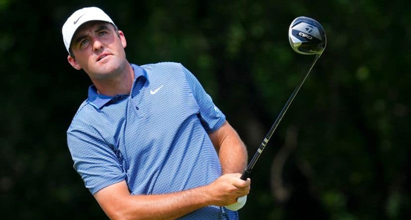 Scottie Scheffler watches a tee shot during the first round of the Charles Schwab Challenge golf tournament at Colonial Country Club in Fort Worth, Texas, Thursday, May 22, 2025. (AP Photo/LM Otero)