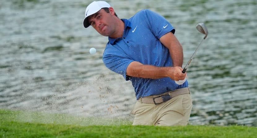 Scottie Scheffler hits out of a bunker on the 18th hole during the first round of the Charles Schwab Challenge golf tournament at Colonial Country Club in Fort Worth, Texas, Thursday, May 22, 2025. (AP Photo/LM Otero)
