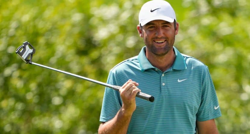 Scottie Scheffler smiles on the seventh hole during the third round of the PGA Championship golf tournament at the Quail Hollow Club, Saturday, May 17, 2025, in Charlotte, N.C. (AP Photo/Matt York)