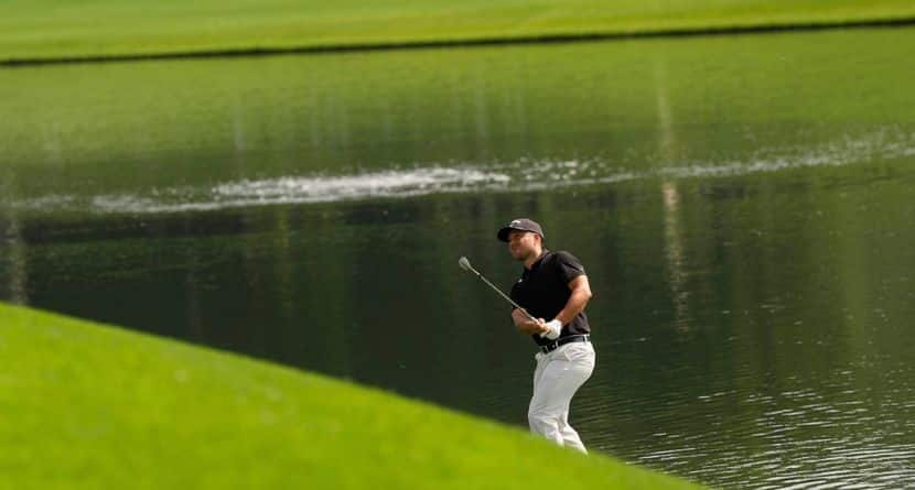 Xander Schauffele chips to the green on the 16th hole during the first round of the PGA Championship golf tournament at the Quail Hollow Club, Thursday, May 15, 2025, in Charlotte, N.C. (AP Photo/David J. Phillip)