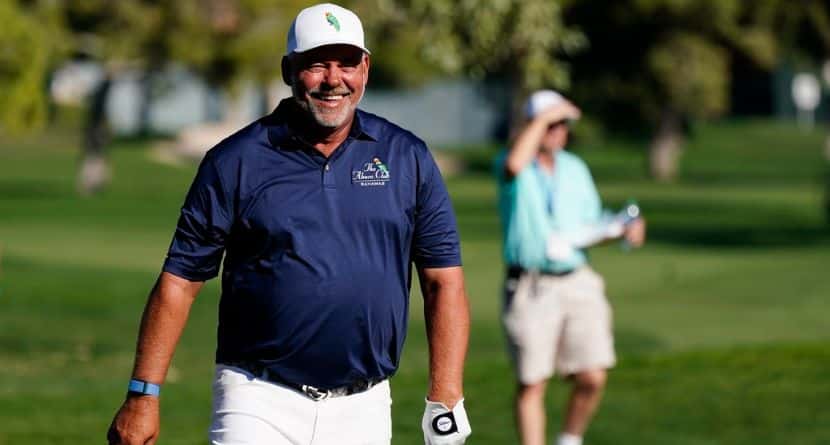 Darren Clarke, of Northern Ireland, laughs along with the gallery after hitting his approach shot into the gallery on the 12th hole during the third round of the Charles Schwab Cup Championship golf tournament Saturday, Nov. 13, 2021, in Phoenix. Clarke sees plenty of bigger events in the future beyond the debut of the signature course at the new PGA of America headquarters in the Senior PGA Championship starting Thursday. (AP Photo/Ross D. Franklin)