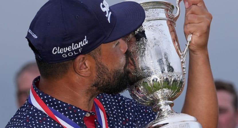 J.J. Spaun celebrates with the trophy after winning the U.S. Open golf tournament at Oakmont Country Club Sunday, June 15, 2025, in Oakmont, Pa. (AP Photo/Carolyn Kaster)