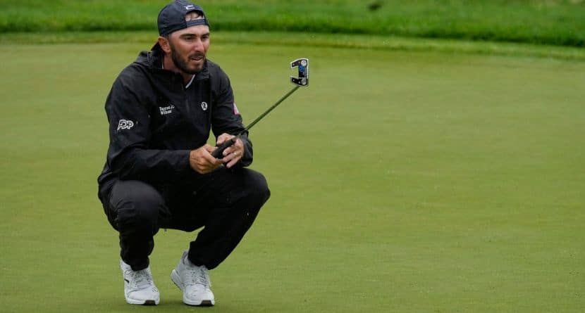 Max Homa lines up his putt on the 13th green during the second round of the Memorial golf tournament, Friday, May 30, 2025, in Dublin, Ohio. (AP Photo/Sue Ogrocki)