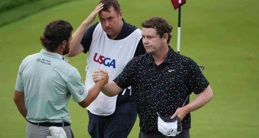 Robert MacIntyre, of Scotland, and Cameron Young, left, shake hands after finishing the final round of the U.S. Open golf tournament at Oakmont Country Club Sunday, June 15, 2025, in Oakmont, Pa. (AP Photo/Gene J. Puskar)