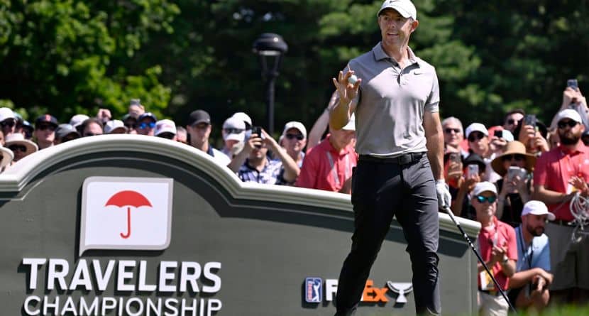 Rory McIlroy of Northern Ireland, waves as he is announced at the first tee during the first round of the Travelers Championship golf tournament at TPC River Highlands, Thursday, June 19, 2025, in Cromwell, Conn. (AP Photo/Jessica Hill)
