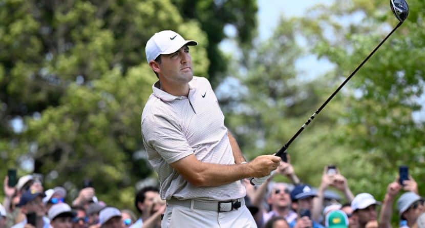 Scottie Scheffler watches his shot from the first tee during the first round of the Travelers Championship golf tournament at TPC River Highlands, Thursday, June 19, 2025, in Cromwell, Conn. (AP Photo/Jessica Hill)