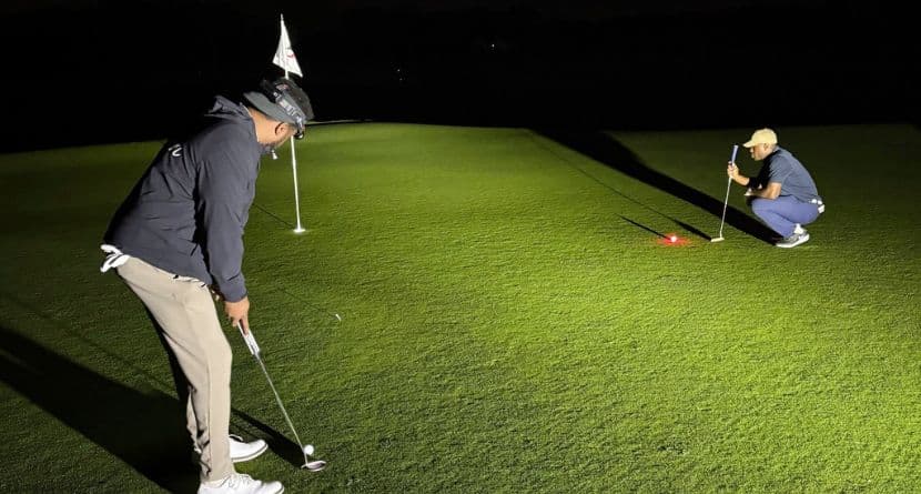 Kelechi Ezihie, right, plays golf at the Huntington Crescent Club in Huntington, N.Y., where he played for 35 straight hours, between Sunday, June 8, 2025 to Tuesday, June 10, 2025, and is seeking validation of the Guinness World Record. (Mac McCoy via AP)