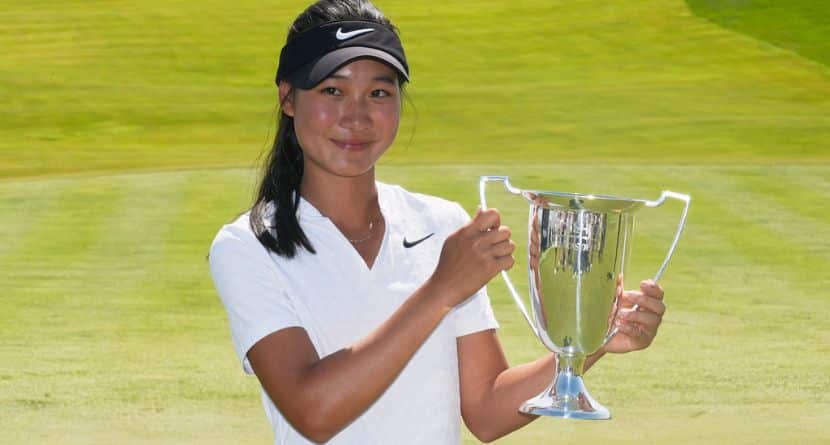 Aphrodite Deng holds her trophy after winning the amateur division of the Mizuho Americas Open LPGA golf tournament, Sunday, May 11, 2025, in Jersey City, N.J. (AP Photo/Seth Wenig)