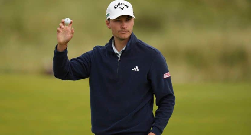 Rasmus Hojgaard of Denmark acknowledges the crowd on the 8th green during the second round of the British Open golf championship at the Royal Portrush Golf Club, Northern Ireland, Friday, July 18, 2025. (AP Photo/Francisco Seco)