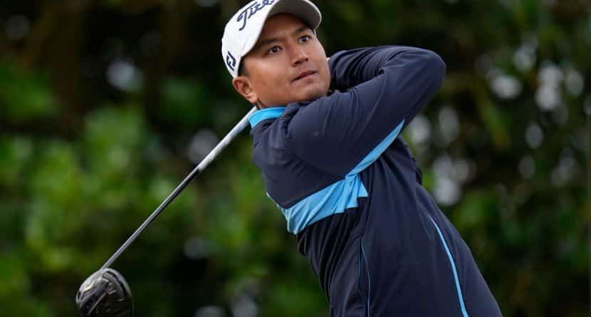 Thailand's Sadom Kaewkanjana plays from the 3rd tee during the first round of the British Open golf championship on the Old Course at St. Andrews, Scotland, July 14, 2022. (AP Photo/Alastair Grant)