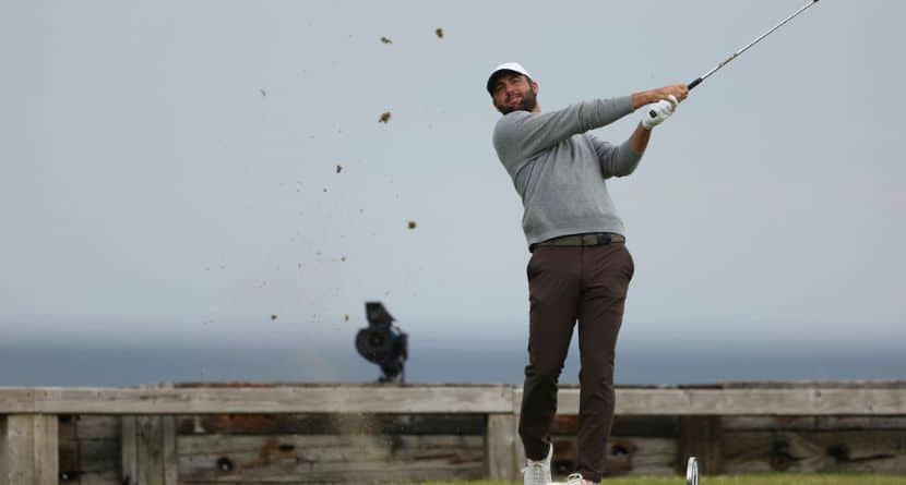 Scottie Scheffler of the United States plays his tee shot on the 6th tee during the first round of the British Open golf championship at the Royal Portrush Golf Club, Northern Ireland, Thursday, July 17, 2025. (AP Photo/Peter Morrison)