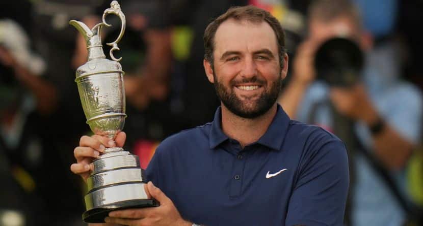 Scottie Scheffler of the United States poses for photographers with the Claret Jug trophy after winning the British Open golf championship at the Royal Portrush Golf Club, Northern Ireland, Sunday, July 20, 2025. (AP Photo/Francisco Seco)