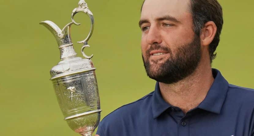 Scottie Scheffler of the United States poses for photographers with the Claret Jug trophy after winning the British Open golf championship at the Royal Portrush Golf Club, Northern Ireland, Sunday, July 20, 2025.(AP Photo/Francisco Seco)