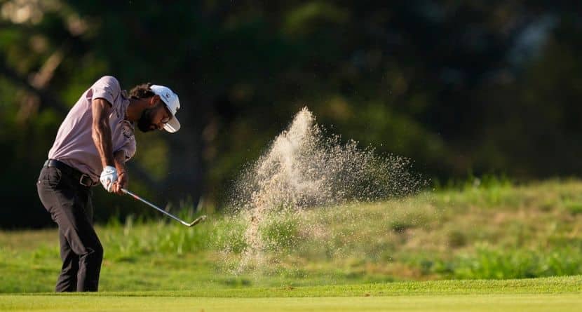 Akshay Bhatia hits out of the bunker on the second hole during the first round of the St. Jude Championship golf tournament Thursday, Aug. 7, 2025, in Memphis, Tenn. (AP Photo/George Walker IV)