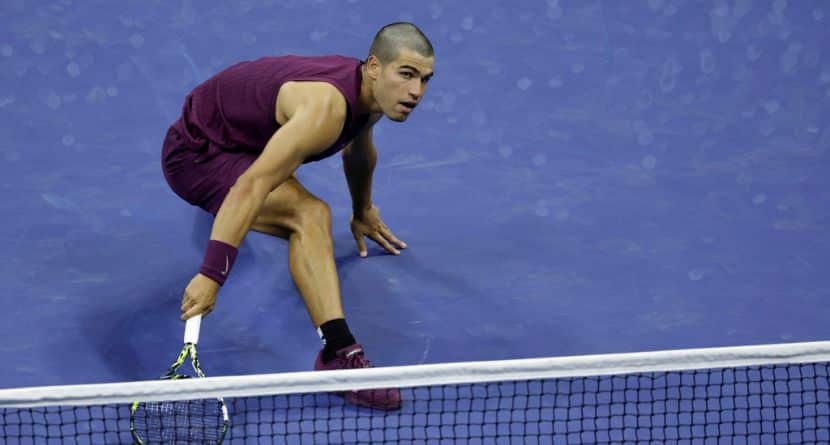 Carlos Alcaraz, of Spain, returns a shot to Reilly Opelka, of the United States, during the first round of the U.S. Open tennis championships, Monday, Aug. 25, 2025, in New York. (AP Photo/Adam Hunger)