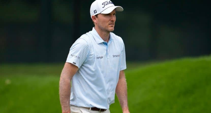Russell Henley walks on the first fairway during the first round of the Tour Championship golf tournament, Thursday, Aug. 21, 2025, in Atlanta. (AP Photo/Mike Stewart)