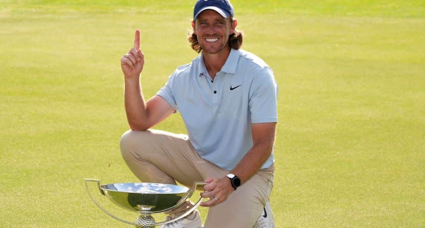 Tommy Fleetwood, of England, holds the championship trophy after the final round of the Tour Championship golf tournament, Sunday, Aug. 24, 2025, in Atlanta. (AP Photo/Mike Stewart)