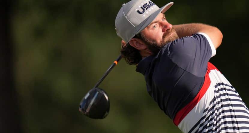 United States' Cameron Young watches his tee shot on the 12th hole at Bethpage Black golf course during the Ryder Cup golf tournament, Friday, Sept. 26, 2025, in Farmingdale, N.Y. (AP Photo/Seth Wenig)