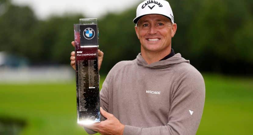 Alex Noren celebrates with the trophy after day four of the 2025 BMW PGA Championship at Wentworth Golf Club in Virginia Water, Surrey, England, Sunday Sept. 14, 2025. (Adam Davy/PA via AP)