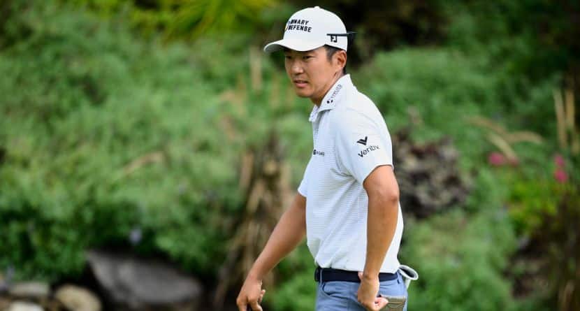 Michael Kim reacts to his putt on the 18th green during the first round of the BMW Championship golf tournament Thursday, Aug. 14, 2025, in Owings Mills, Md. (AP Photo/Nick Wass)