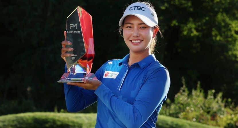 Miranda Wang, of China, holds the trophy after winning the FM Championship LPGA golf tournament at TPC Boston, Sunday, Aug. 31, 2025, in Norton, Mass. (AP Photo/Michael Dwyer)
