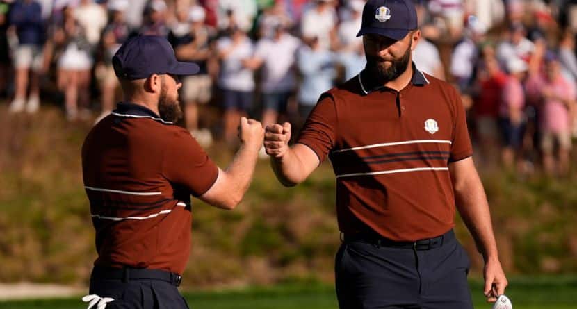 Europe's Tyrrell Hatton celebrates with Jon Rahm on the sixth hole at Bethpage Black golf course during the Ryder Cup golf tournament, Saturday, Sept. 27, 2025, in Farmingdale, N.Y. (AP Photo/Robert Bukaty)