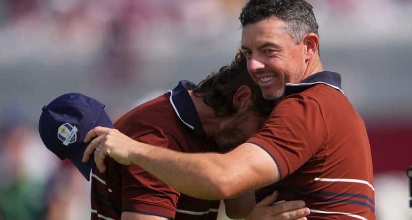 Europe's Rory McIlroy and Tommy Fleetwood hug after they won their match at Bethpage Black golf course during the Ryder Cup golf tournament, Saturday, Sept. 27, 2025, in Farmingdale, N.Y. (AP Photo/Lindsey Wasson)