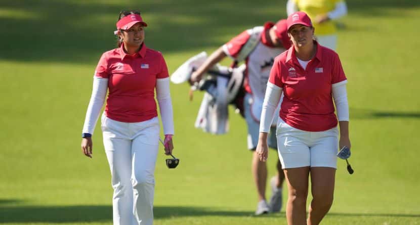 Lauren Coughlin, right, and Lilia Vu of the United States, walk to the first green during the pool A match against China team for the LPGA International Crown golf tournament at the New Korea Country Club in Goyang, South Korea, Thursday, Oct. 23, 2025. (AP Photo/Lee Jin-man)