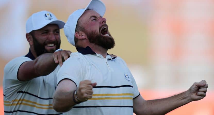 Europe's Shane Lowry celebrates with Jon Rahm after making the winning putt on the 18th hole during their singles match on the Bethpage Black golf course at the Ryder Cup golf tournament, Sunday, Sept. 28, 2025, in Farmingdale, N.Y. (AP Photo/Seth Wenig)