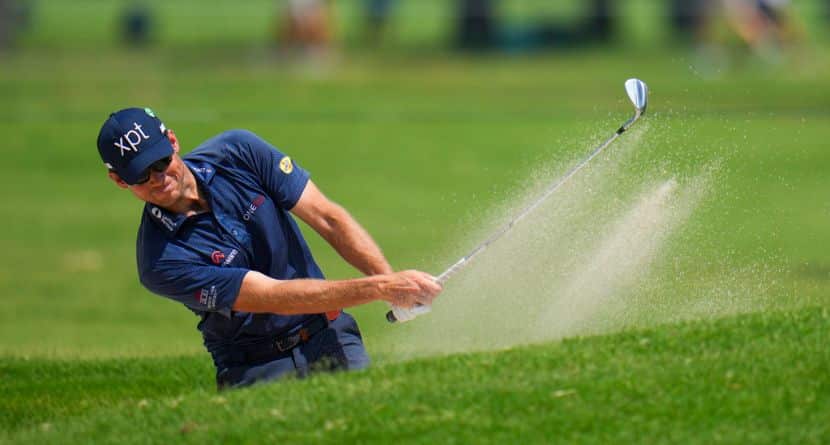 Adam Schenk hits off a bunker on the 15th hole during the first round of the Charles Schwab Challenge golf tournament at Colonial Country Club in Fort Worth, Texas, Thursday, May 22, 2025. (AP Photo/Julio Cortez)